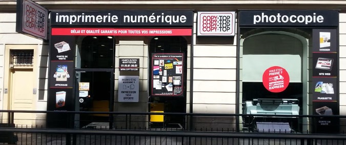 Vitrine imprimeur COPY-TOP Paris | agence Champs-Élysées