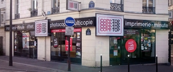 Vitrine imprimeur COPY-TOP Paris | agence Papillon - La Fayette