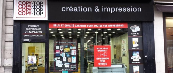 Vitrine imprimeur COPY-TOP Paris | agence Pyramides - Palais Royal